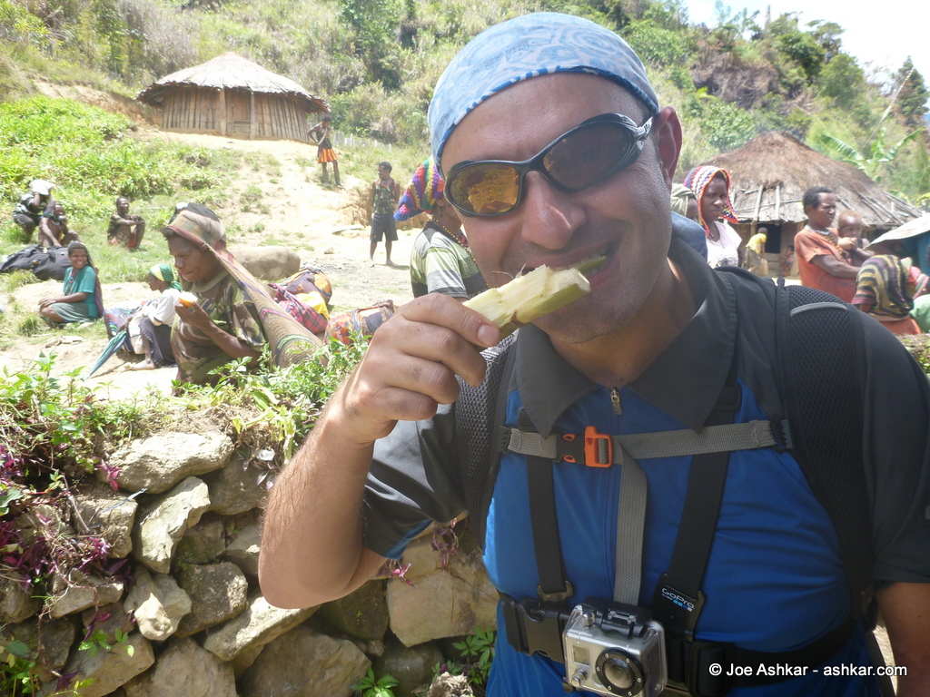 Enjoying freshly cut Sugar Cane.