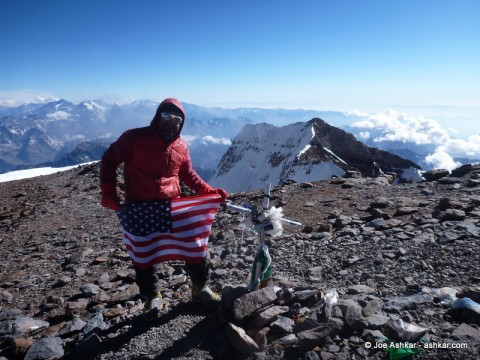 Joe Ashkar standing on top of Cerro Aconcagua, the highest peak in the Americas and outside of Asia.