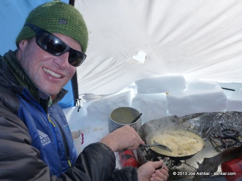Garrett scrambling Huevos for breakfast.