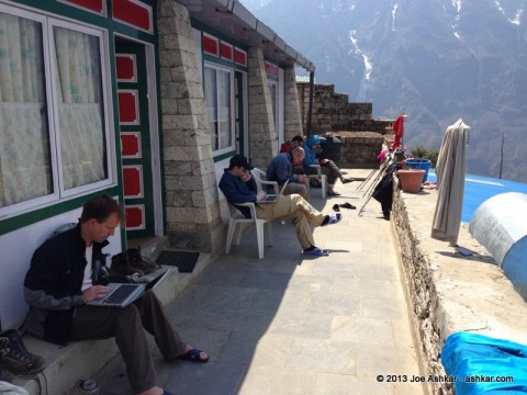 Team members busy checking emails and social media.