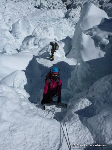 Climbing up & down vertical ladders in the Icefall.